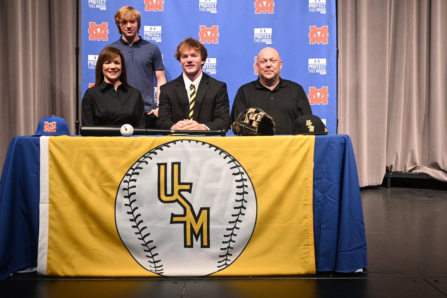 Madison Central High School senior Chase Russell signed a national letter of intent to play baseball at the University of Southern Mississippi. Pictured left to right are Dawn Russell (mom), Russell, and Dale Russell (dad). Standing is Rhett Russell (brother).